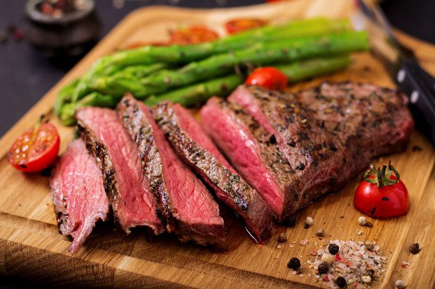 juicy-steak-rare-beef-with-spices-wooden-board-garnish-asparagus_2829-1513.jpg